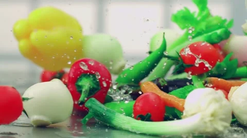 Various vegetables pass in front of the camera. Stock Footage 135807801