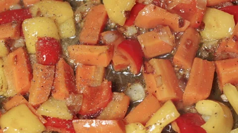 Various vegetables with pepper being fried in oil Stock Footage 45416904