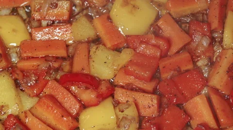 Various vegetables with pepper being fried in oil, close up Stock Footage 45417073