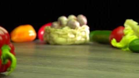 Various vegetables shot on a black background. Turn. Are falling. Stock Footage 117106572
