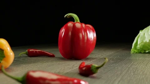 Various vegetables shot on a black background. Turn. Are falling. Stock Footage 117109471