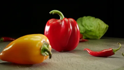 Various vegetables shot on a black background. Turn. Are falling. Stock Footage 117109527