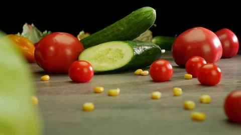 Various vegetables shot on a black background. Turn. Are falling. Stock Footage 117110364