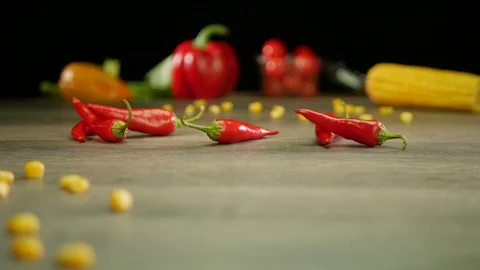 Various vegetables shot on a black background. Turn. Are falling. Stock Footage 117110445