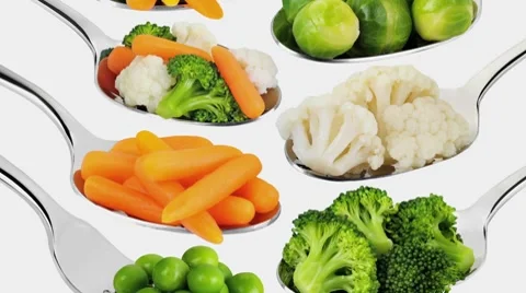 Various vegetables on spoons and forks Stock Footage 8574490