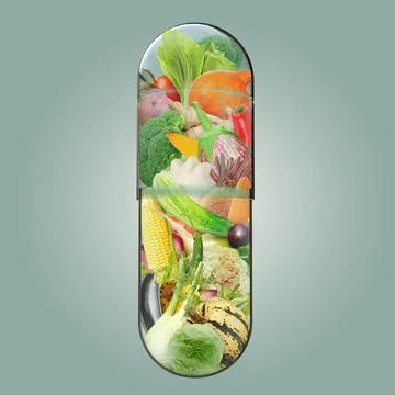 Various vegetables in a transparent two-piece, hard starch capsule Foto stock