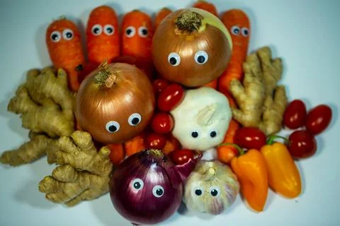 Various vegetables on a white background, ginger, garlic, carrot, potato, t.. Stock Photos
