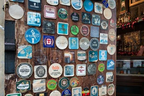 Various Vintage Table Coasters Inside Pub Arezzo 写真素材