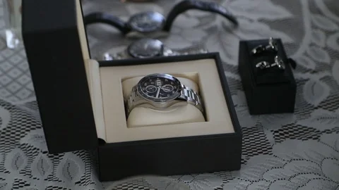 Various watches lined up on table in slow motion Stock Footage 88712214