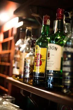Various whisky bottles displayed in a pub Stock Photos