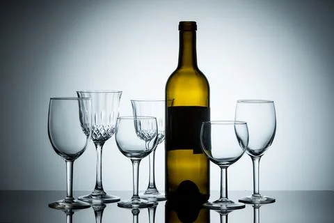 Various wine glasses with a bottle. Stock Photos