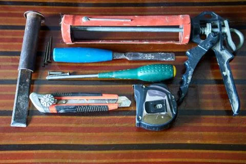 Various work tools on a brown table Stockfoto's