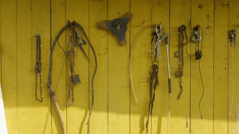 Various working tools on the wall of the village house 스톡 동영상 121492784