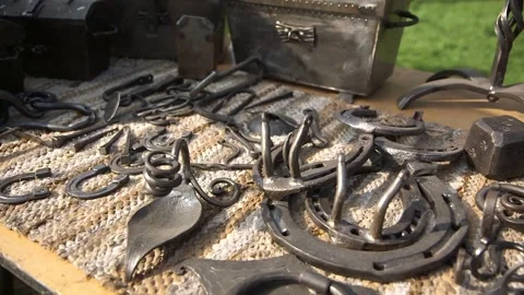Various Wrought Metal Objects Arranged in the Market on a Table. Stock Footage 271153314