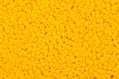 Various yellow seed beads. Stock Photos