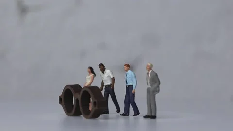 Various miniature people standing behind the glasses. Video stock 232595170