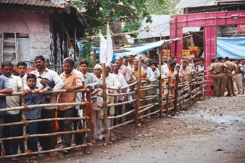 Varkari standing in queue for ekadashi at Vithal temple Copyright: xMukesh... Stock Photos