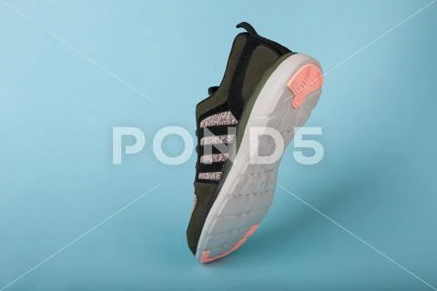 Varna , Bulgaria - APRIL 13, 2019 : ADIDAS X LITE Woman sport shoe, on blue b Stock Photos