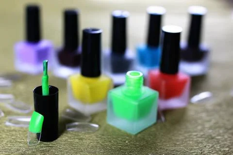 Varnish manicure false nails a small set of detail for manicure on a gold ... Stock Photos