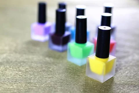Varnish manicure false nails a small set of detail for manicure on a gold ... Stock Photos