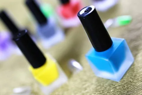 Varnish manicure false nails a small set of detail for manicure on a gold ... Stock Photos
