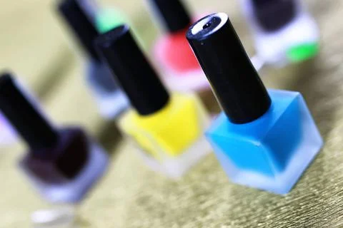 Varnish manicure false nails a small set of detail for manicure on a gold ... Stock Photos