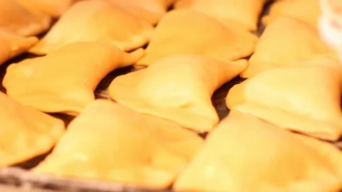 Varnishing bread with egg to give it a golden consistency Stock-Footage 130086065
