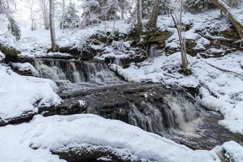 Vasaristi tiny cascade in winter, Lahemaa national park, Estonia. Long exposu Stock Photos