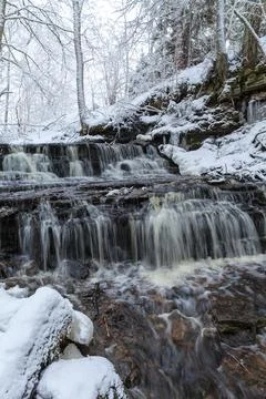 Vasaristi tiny cascade in winter, Lahemaa national park, Estonia. Long exposu Stock Photos