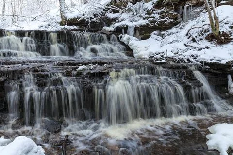 Vasaristi tiny cascade in winter, Lahemaa national park, Estonia. Long exposu Stock Photos