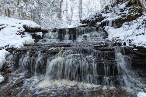 Vasaristi tiny cascade in winter, Lahemaa national park, Estonia. Long exposu Stock Photos