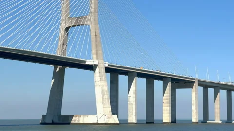 Vasco da Gama Bridge bridge seen during the sunny day, Lisbon city life. 库存影片 248109655