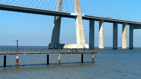 Vasco da Gama Bridge bridge seen during the sunny day, Lisbon city life. Stock-Footage 248109734