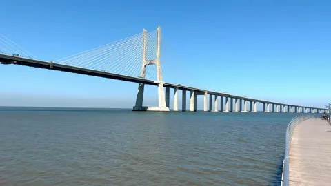 Vasco da Gama Bridge bridge seen during the sunny day, Lisbon city life. 库存影片 248109822
