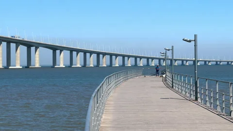 Vasco da Gama Bridge bridge seen during the sunny day, Lisbon city life. 库存影片 248109906