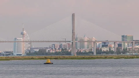 Vasco da Gama Bridge over river Tagus timelapse in Lisbon with park of Nations Vidéo 277356879