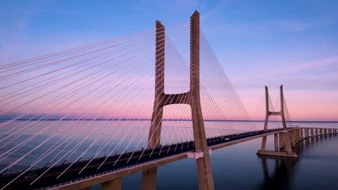 Vasco Da Gama Bridge over the Tagus River at purple sunset. Stock Footage 297700836