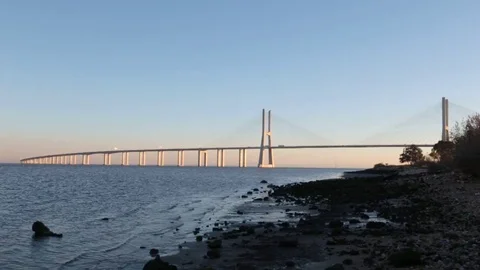 Vasco da Gama brige in sunset light. view from shore Stock Footage 72064198