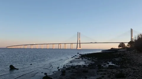 Vasco da Gama brige in sunset light. view from shore Stock Footage 72065701