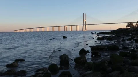 Vasco da Gama brige in sunset light. view from shore Stock Footage 72066324