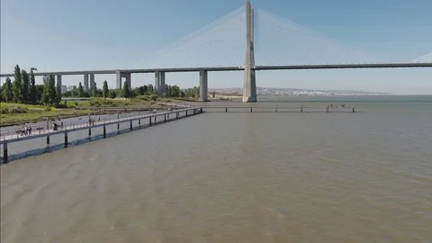 Vasco da Gama Cable stayed bridge river tagus in lisbon Portugal aerial shot 4k Stock Footage 105127236