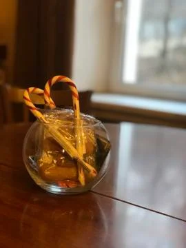 Vase with christmas candy on the table Stock Photos