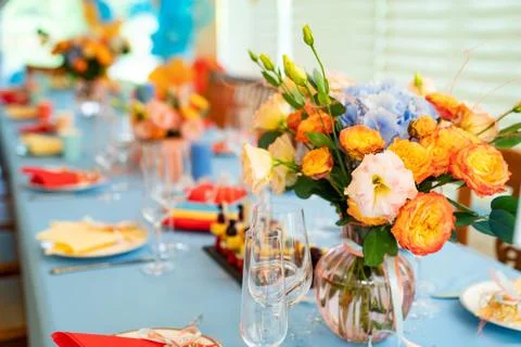 Vase with flowers on festive table. decoration of celebratory Banquet. Stock Photos