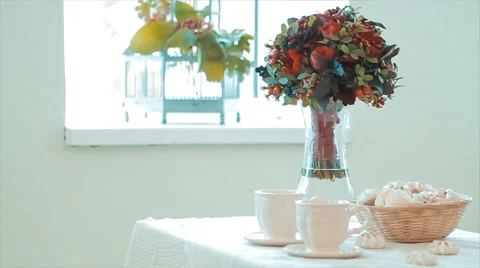 Vase of Flowers Standing on Table Stock Footage 68690330