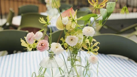 Vase with flowers on the table in a cafe. Table in a restaurant before the Stock Footage 318063776