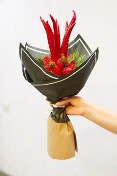A vase of flowers on a table Stock Photos