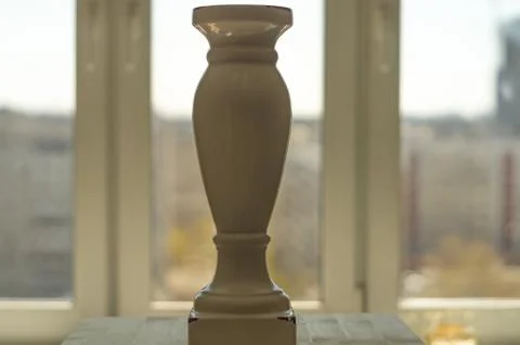 Vase in front of the window Stock Photos
