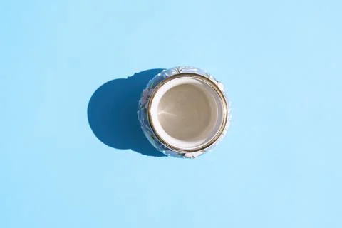 Vase with a hard shadow on a colored background Photos