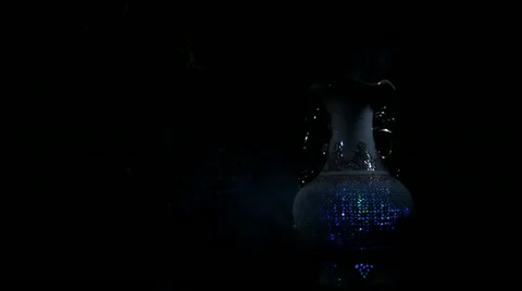 Vase in light of a lamp Stock Footage 12754287