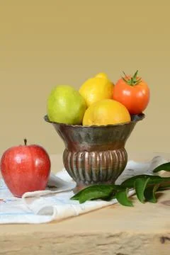 Vase with Produce on Table Stock Photos